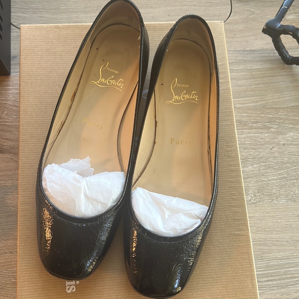 Christian Louboutin flats.